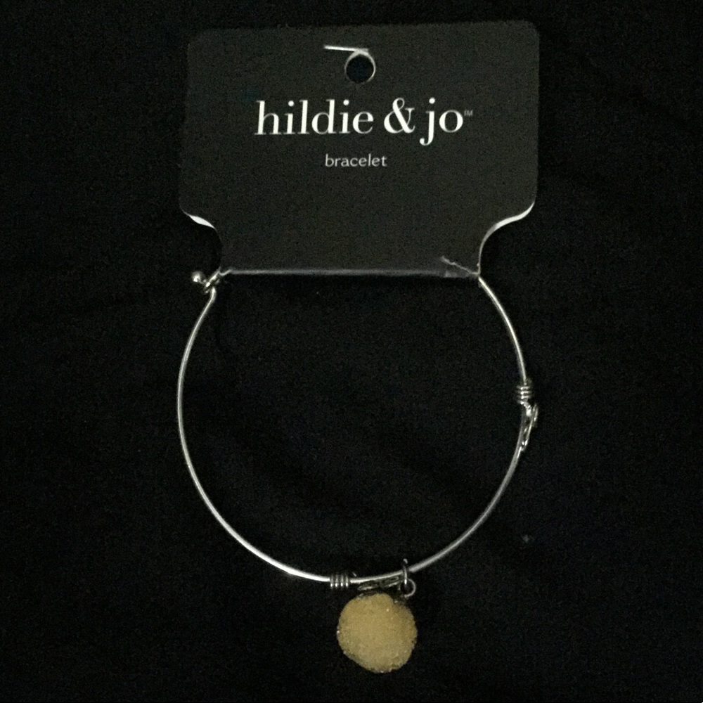 Silver charm bracelet with yellow crystal